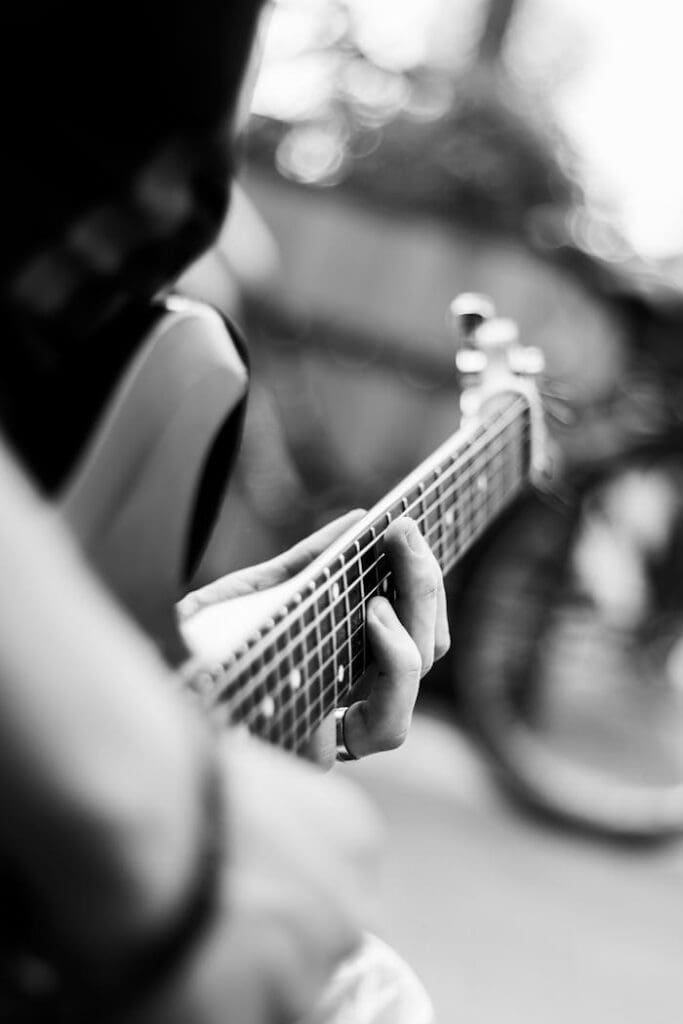Person Playing Electric Guitar